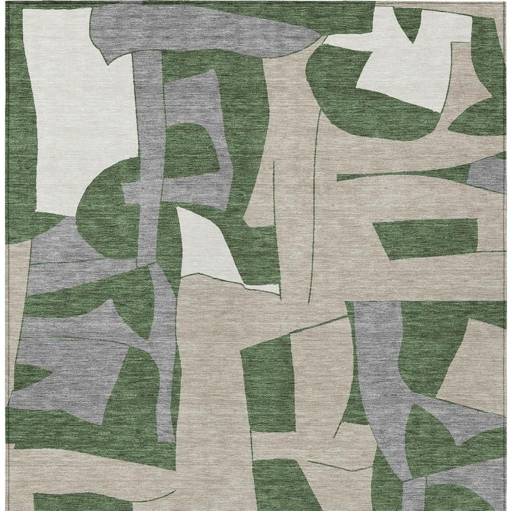 Abstract area rug featuring muted green, beige, and gray shapes, woven from durable, soft materials. Ideal for modern decor.