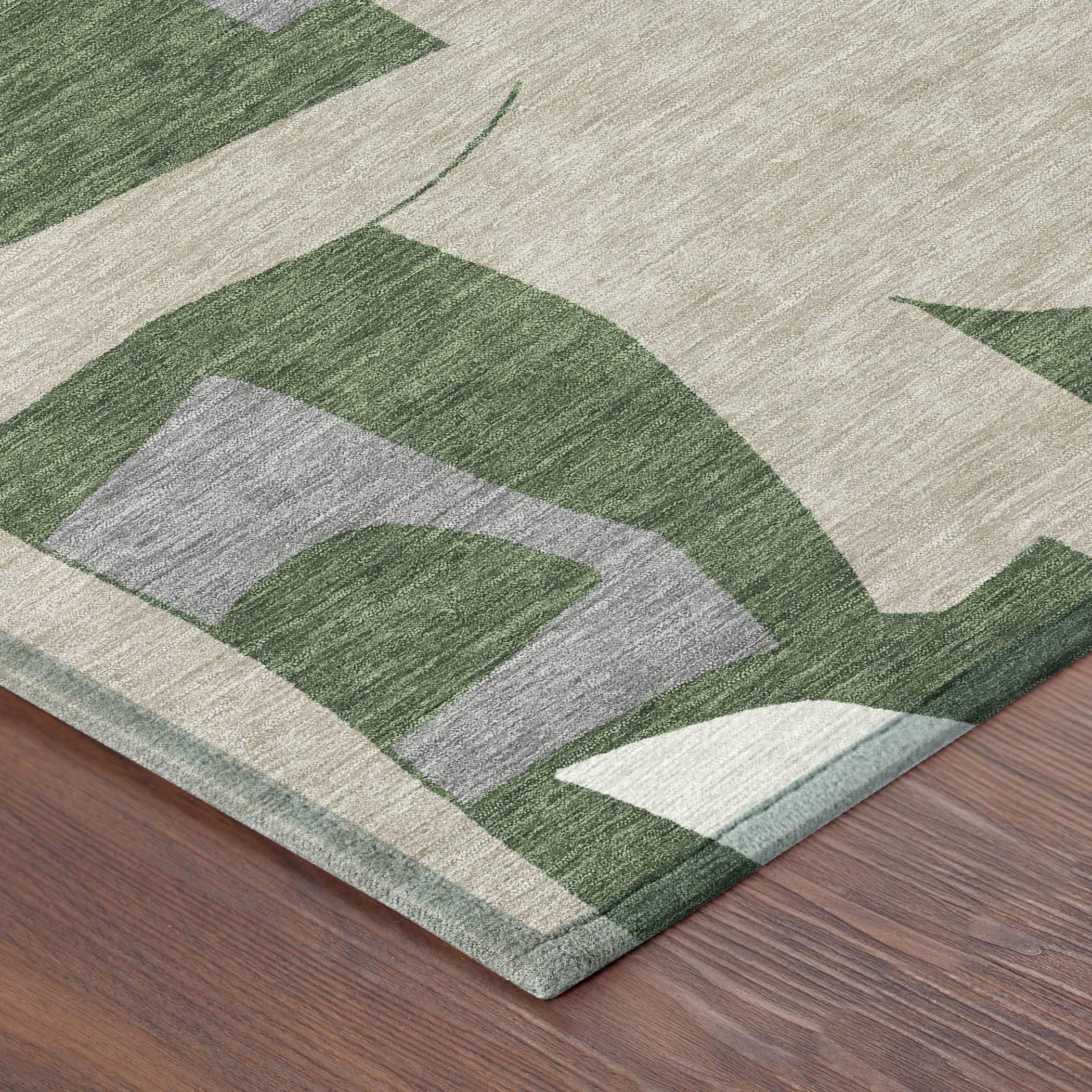 Neutral abstract area rug in green and gray, crafted from soft, durable fibers, perfect for modern home decor.