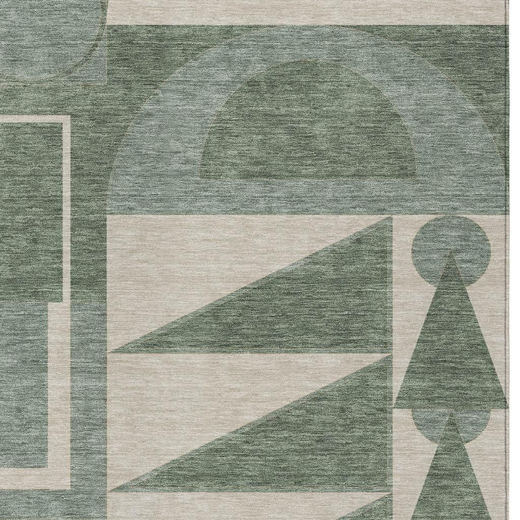 Geometric area rug in green and beige, crafted from soft, durable fibers for modern decor.