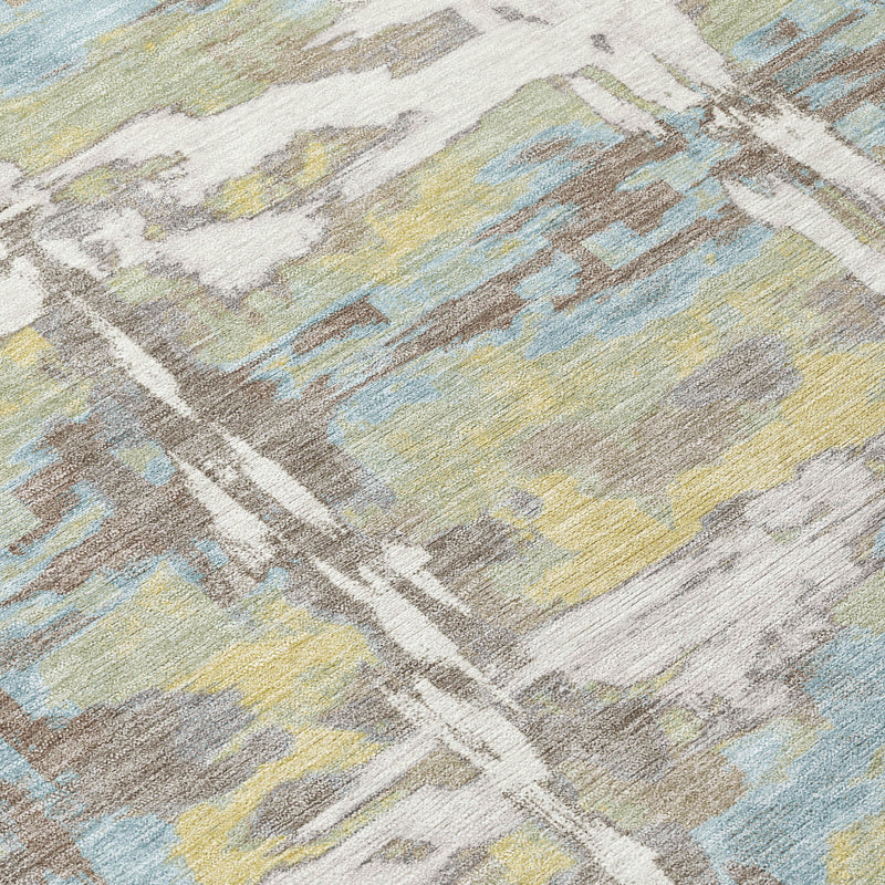 Abstract area rug close-up with diagonal brushstrokes and muted ivory, green, and blue blocks