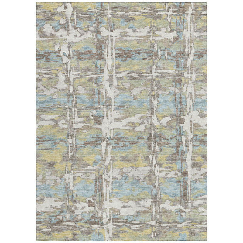 Abstract area rug flatlay with ivory base and muted green, blue, and yellow distressed grid