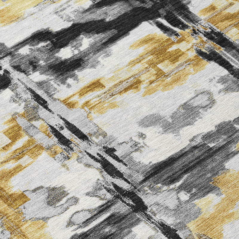 Abstract rug section with light gray base and black and gold brush stripes
