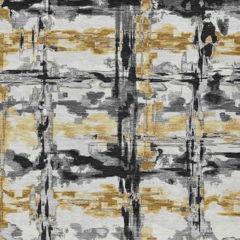 Abstract area rug surface with gray, charcoal, and gold vertical stroke pattern