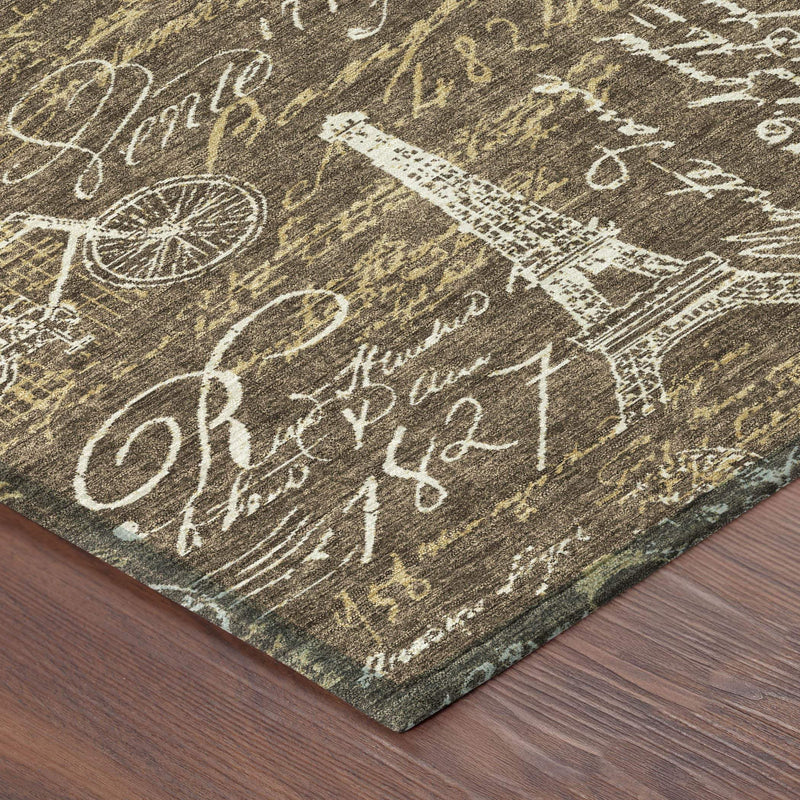 Southwestern area rug corner close-up, dark brown with white script and bicycle prints