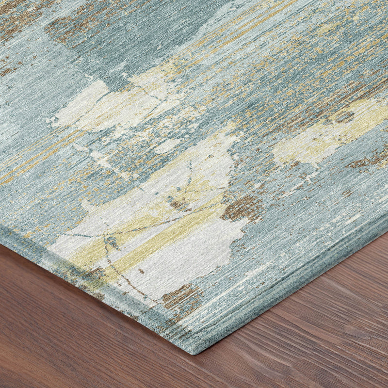 Close-up of round abstract area rug texture in teal blue and pale yellow