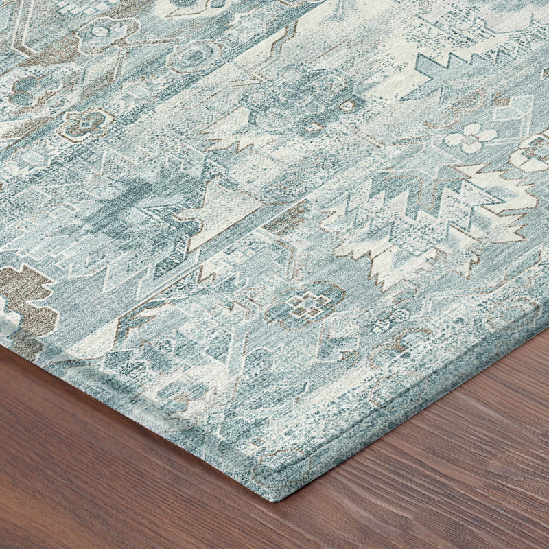 Teal and silver geometric area rug corner view, low-pile textured pattern.