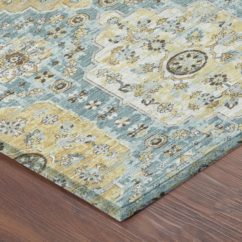 Edge of round damask rug, blue and gold floral motif on textured pile