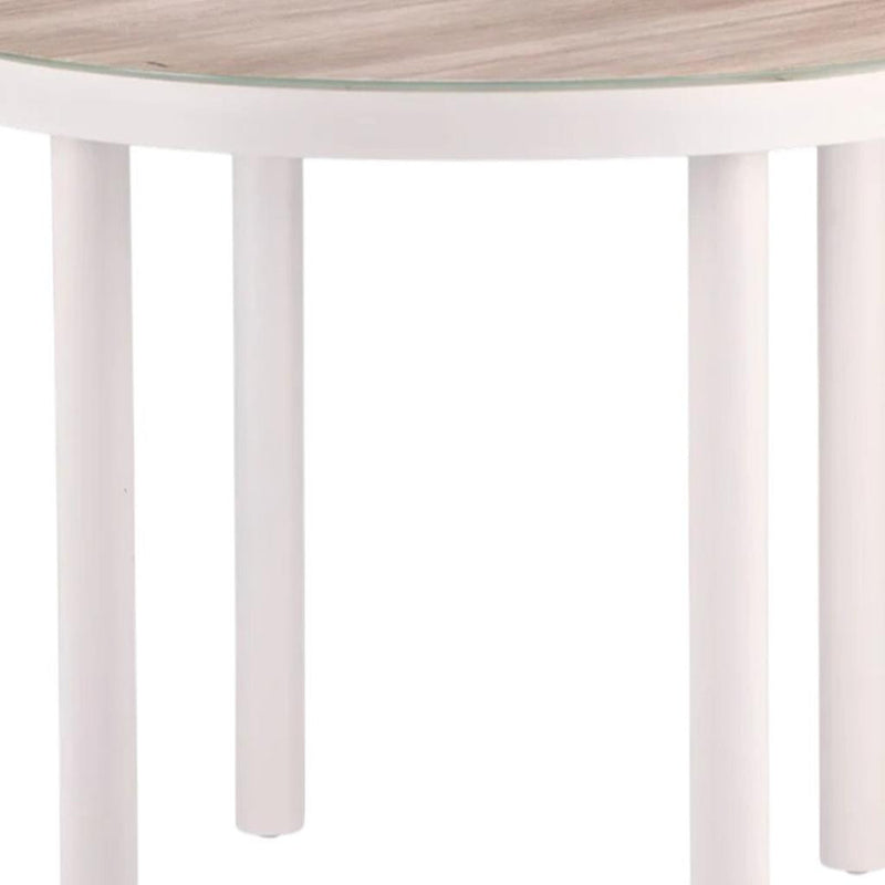 White round table base with four legs under a light wood tabletop