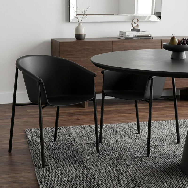 Black plastic outdoor dining chair with curved seat and back on straight legs