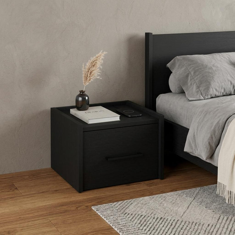 Black one-drawer nightstand with horizontal bar pull and flat top surface