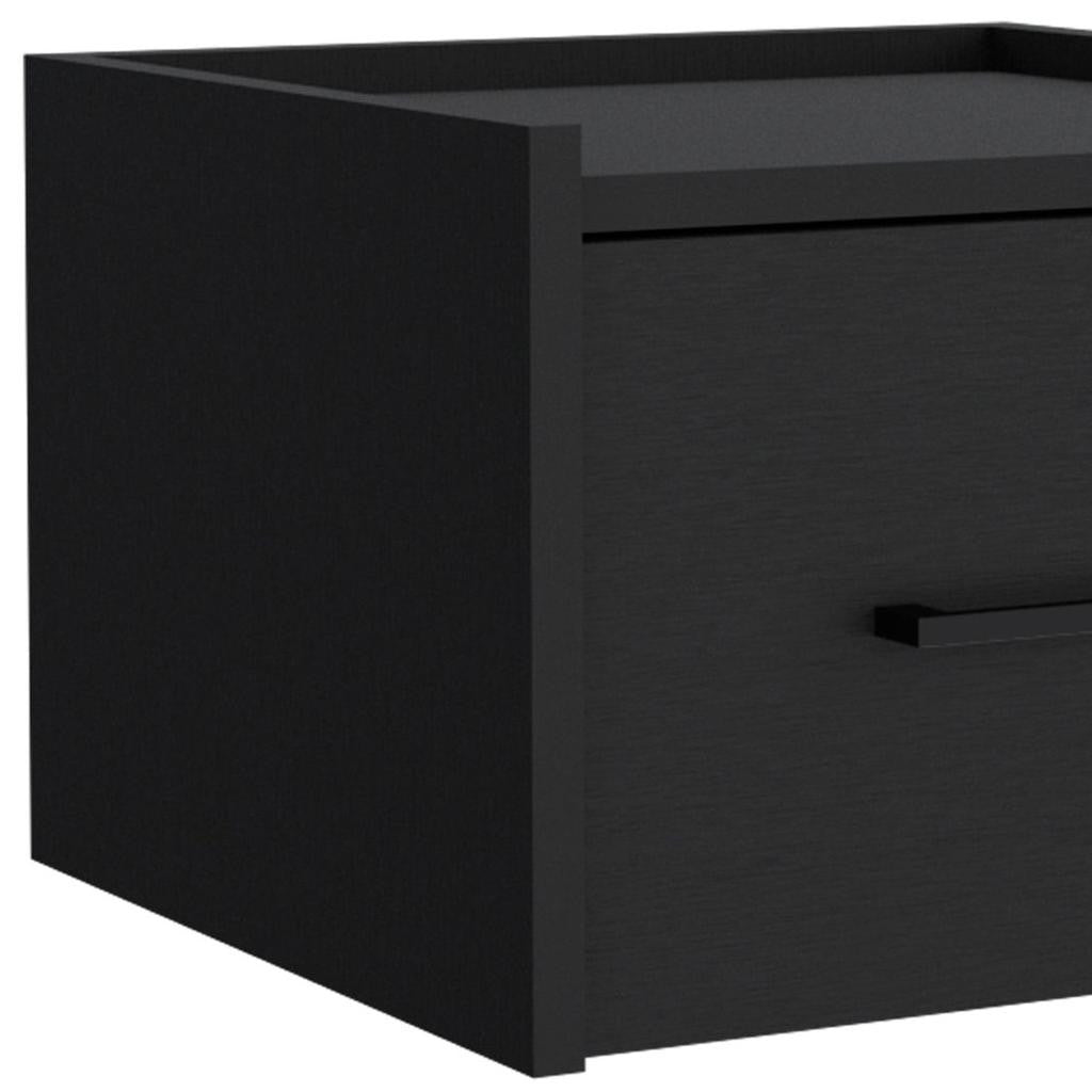 Close-up of black one-drawer nightstand with bar pull and flat top