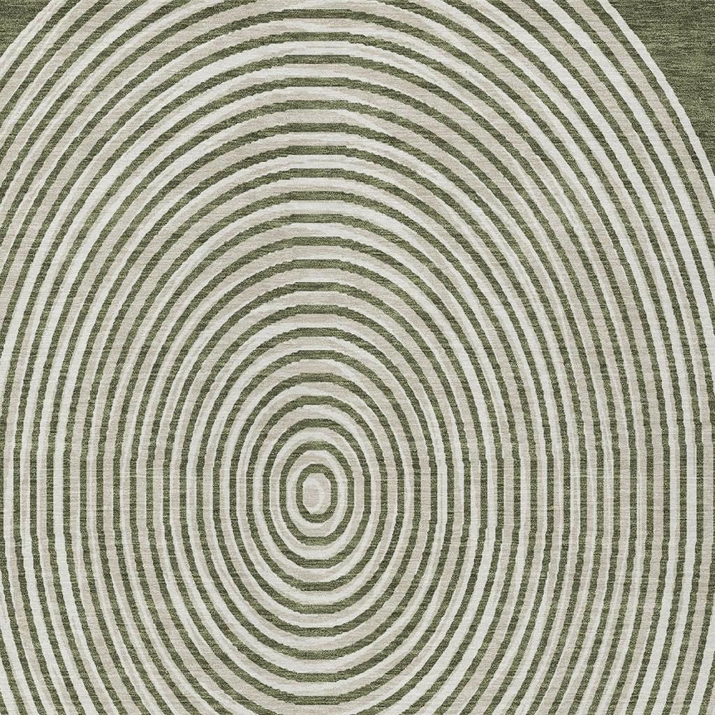 Olive green area rug with concentric white circles, made from soft, durable fibers in a modern style.