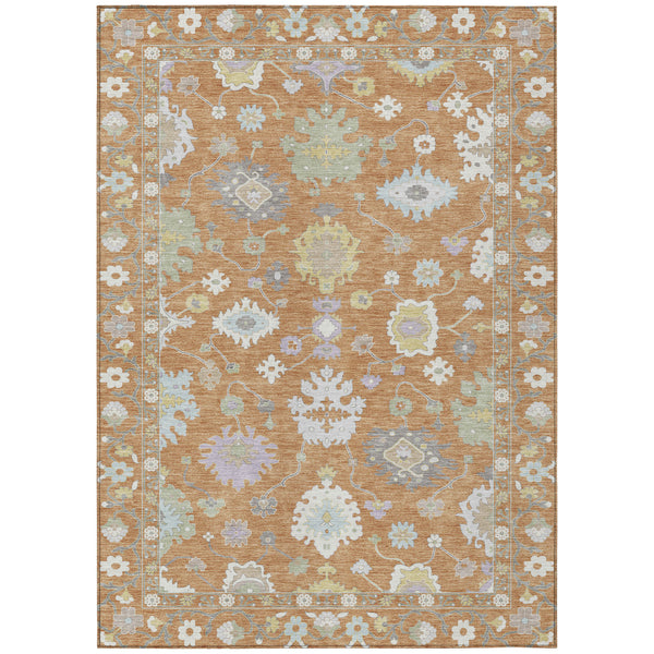 Indoor/outdoor area rug, copper and gold with light blue ornate medallion pattern