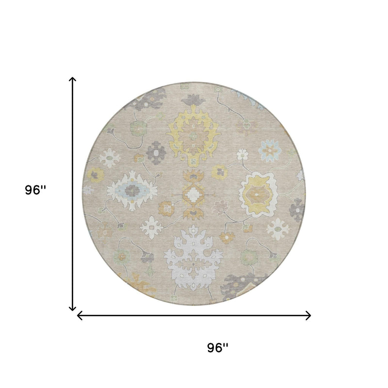 Round rug with ivory base, gray outlines, and yellow and white decorative floral patches