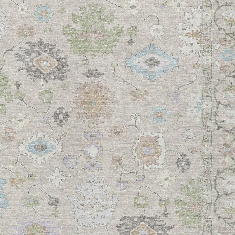 Close-up of light gray rug showing pastel blue, green, and beige medallions