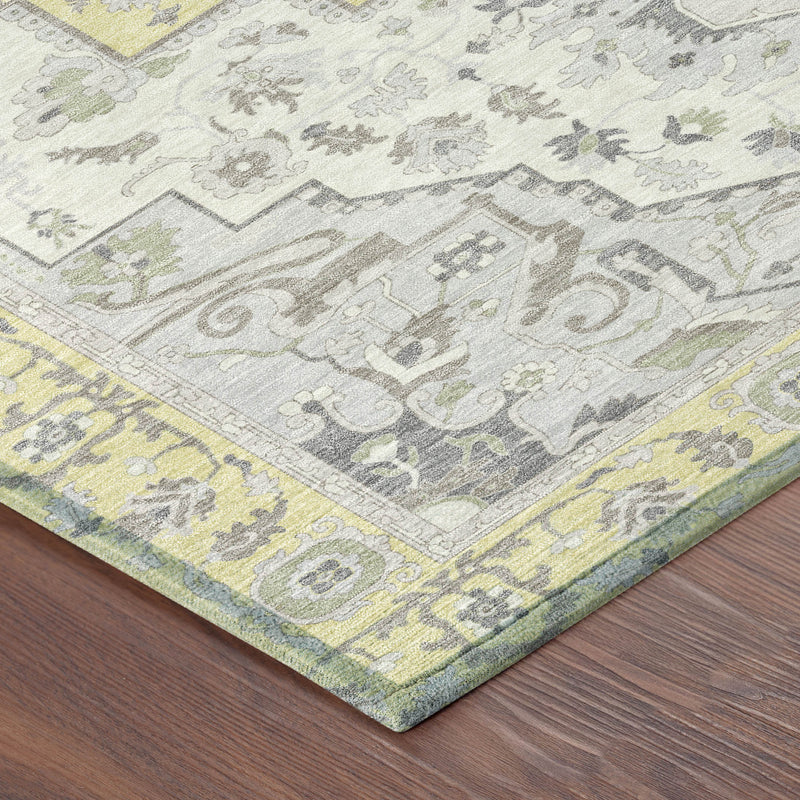 Oriental area rug with gray vine pattern and light yellow border, corner close-up