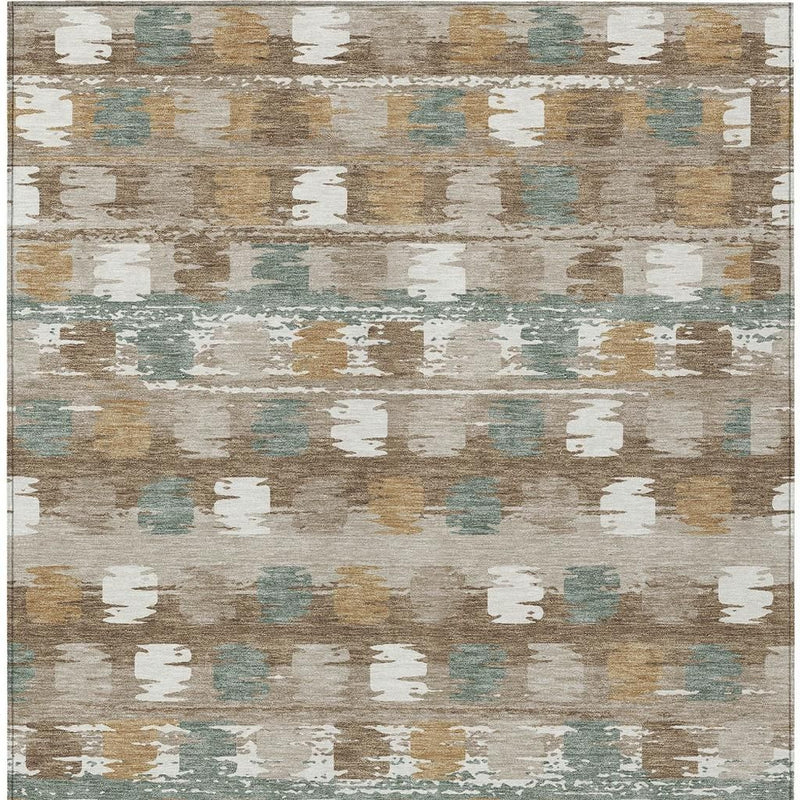 Abstract area rug with distressed block pattern in brown, aqua, and cream