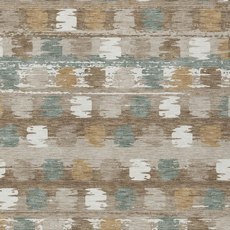 Abstract distressed area rug pattern in tan, brown, aqua, and white