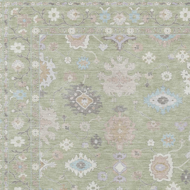 Close-up of green and teal oriental area rug with pastel medallion and rosette motifs