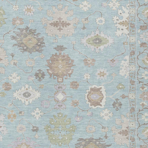 Sky blue oriental area rug with cream and copper-toned geometric medallions