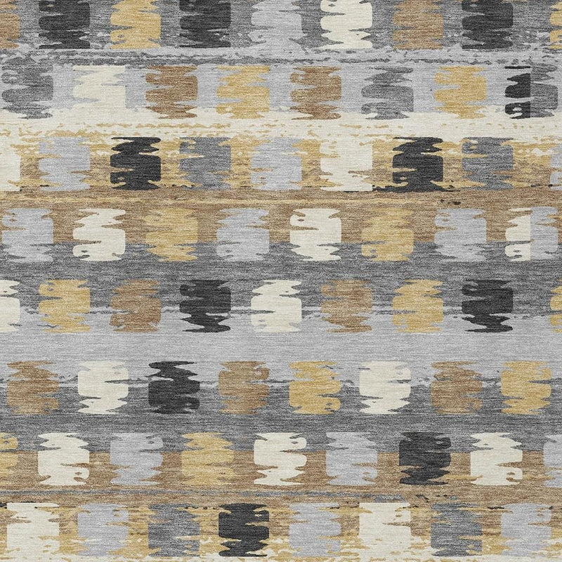 Abstract gray area rug with repeating beige, mustard, and dark charcoal vertical blocks.