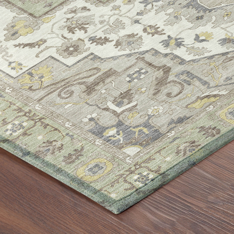Corner of oriental area rug with light green ground, cream floral pattern, multicolor accents.