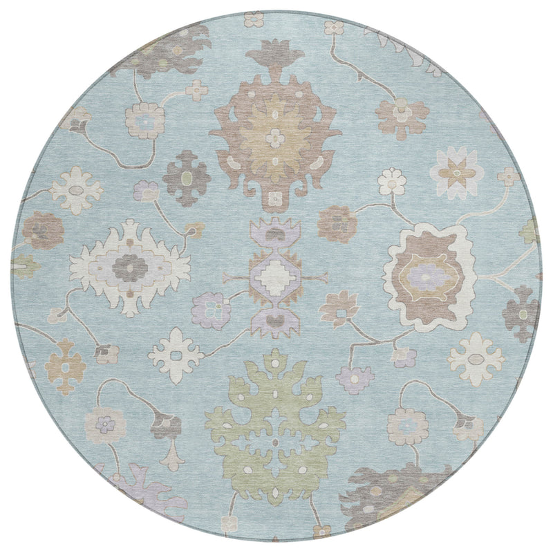 Round blue oriental area rug with dense floral medallions and curving vine outlines