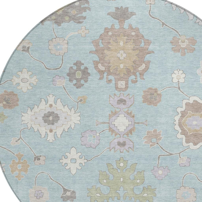 Round blue oriental rug with central rosette medallion and surrounding floral motifs