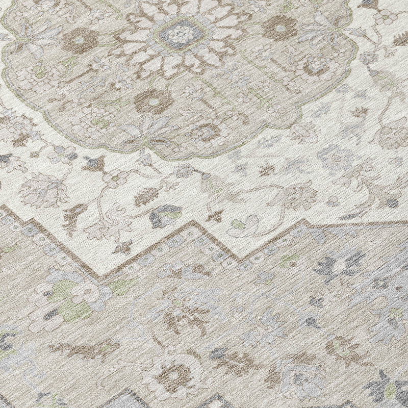 Ivory oriental rug close-up with ornate scrolling motifs in muted green and blue