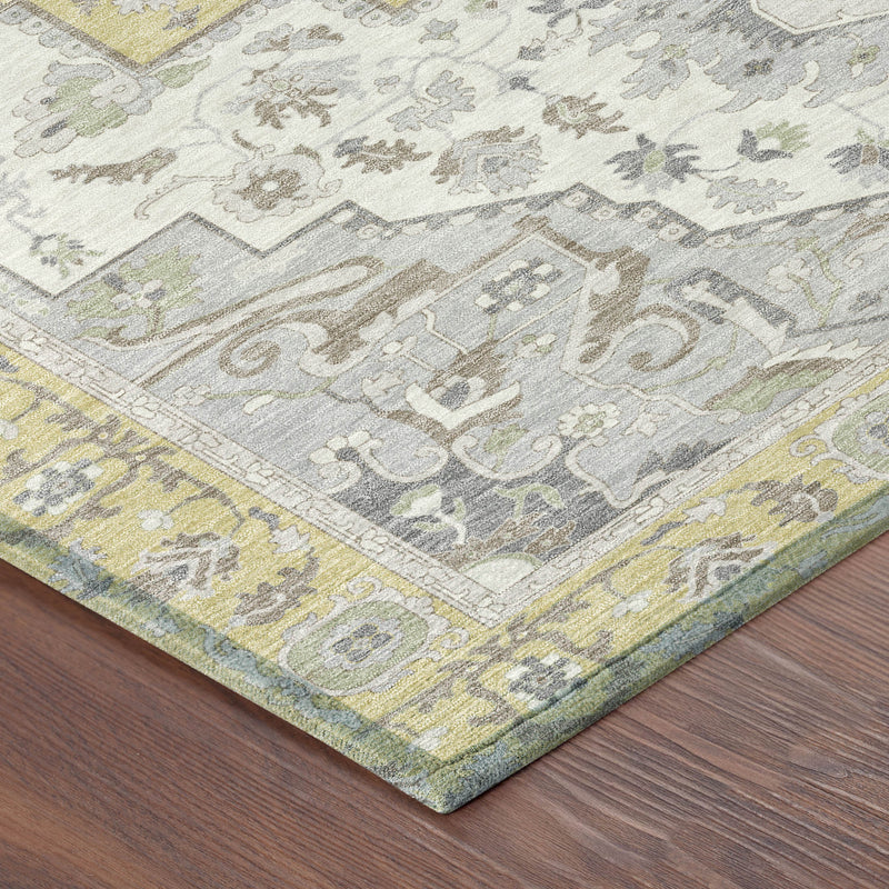 Indoor outdoor area rug corner with detailed gray and yellow ornamental border design