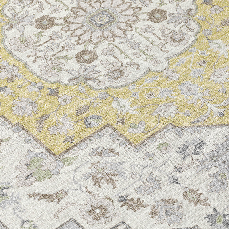 Indoor outdoor area rug close-up of cream, taupe, and yellow floral and vine motifs