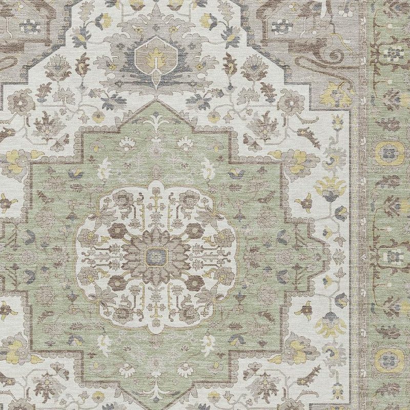 Green oriental rug center medallion with cream floral ornament and muted multicolor accents