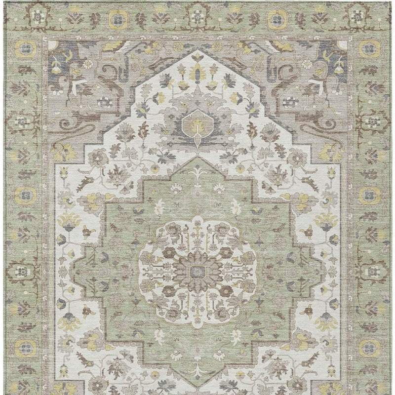 Green oriental rug with centered cream medallion and multicolor decorative border