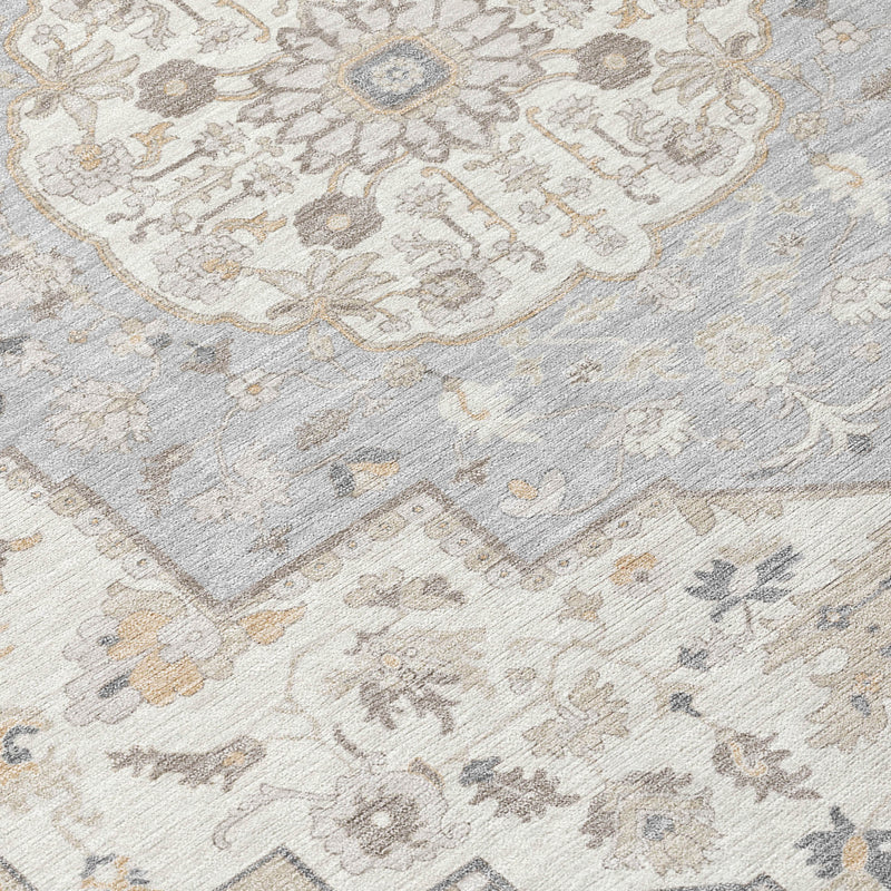 Decorative oriental area rug corner with gray, cream, and small tan motif accents