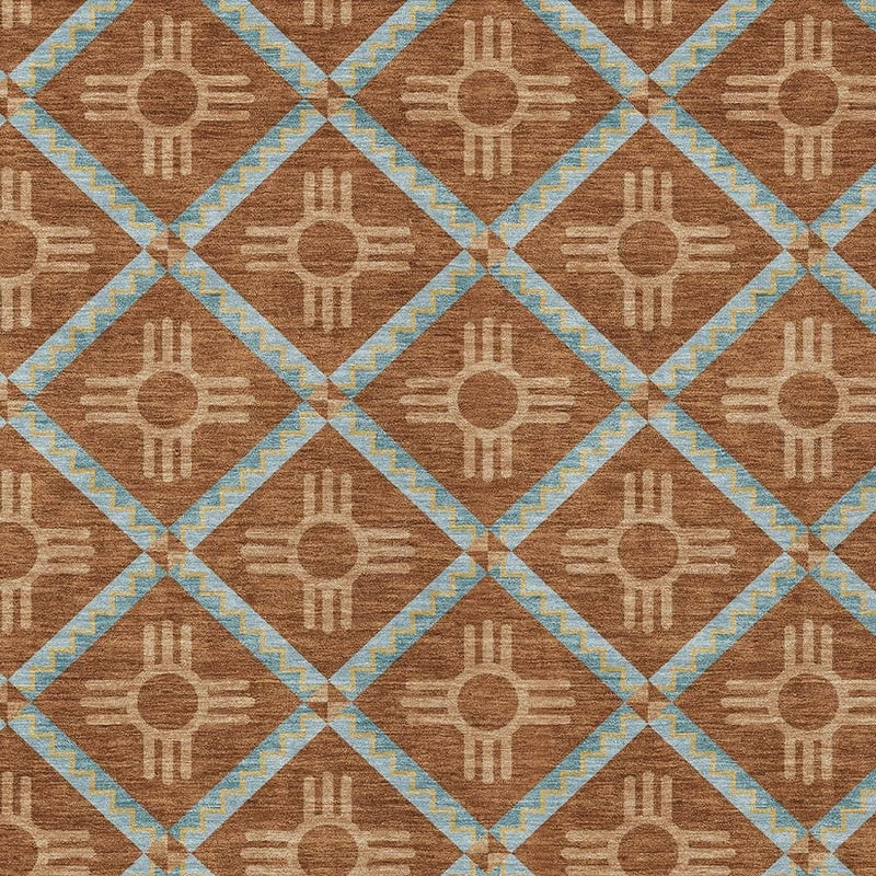Geometric area rug close-up with brown diamond tiles, light blue borders, and tan symbol motifs