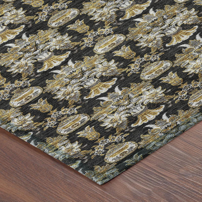 Corner view of black and wheat floral medallion area rug on wood floor