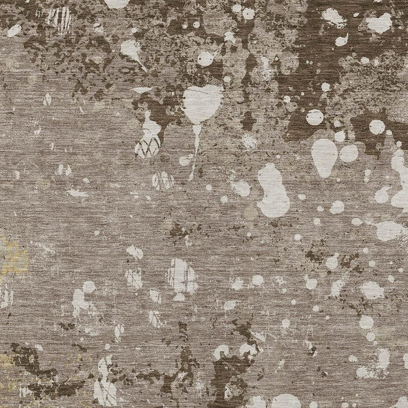 Taupe and ivory abstract area rug surface with scattered white shapes