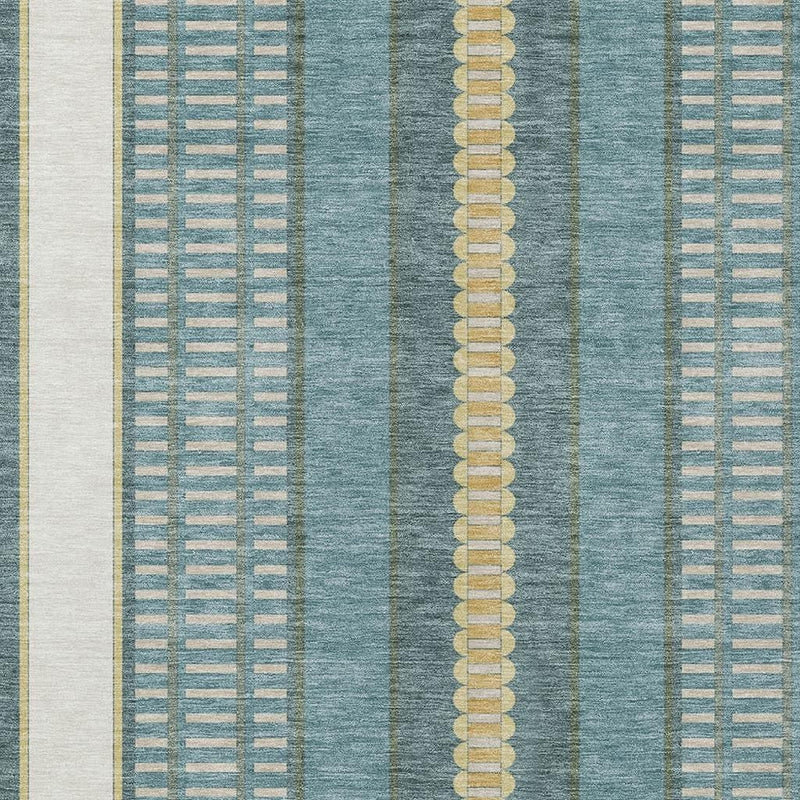 Close-up of teal rug pattern with gold vertical stripe and dotted accents