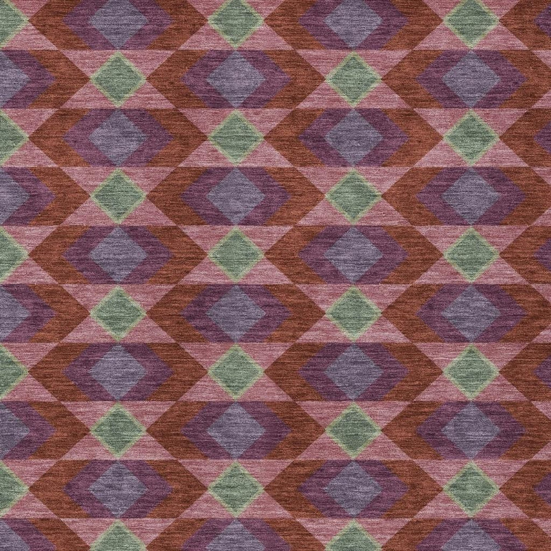 Close-up geometric area rug texture with burgundy, gray, purple, and green diamond shapes