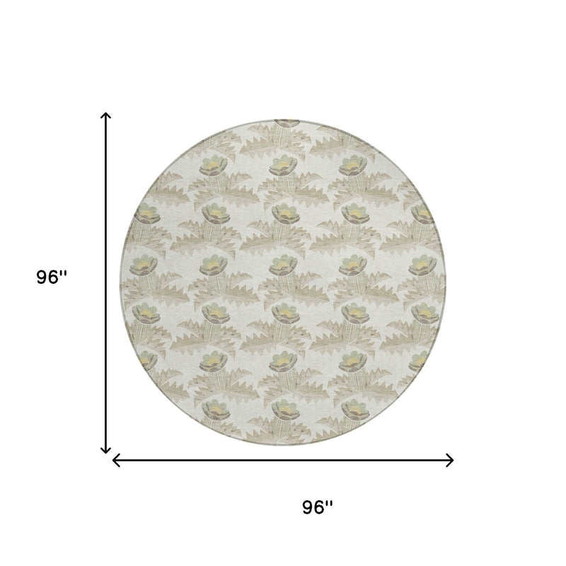 Round area rug, ivory background with repeating tulip-like motifs; thin border edge