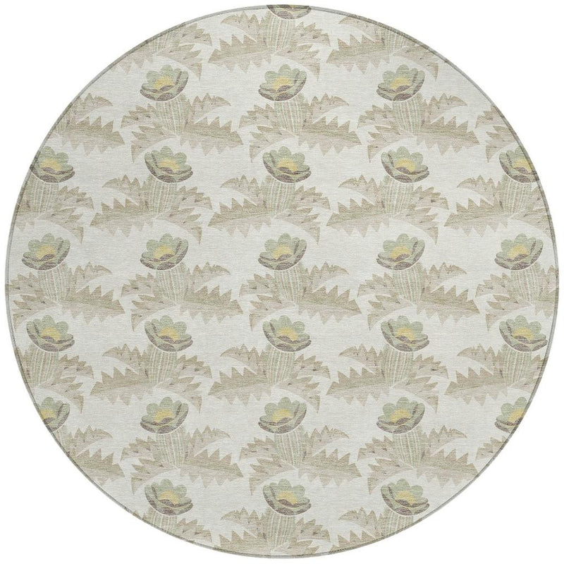 Round washable area rug, light ivory with repeating green-and-gray floral motifs