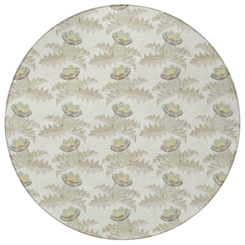 Round area rug in ivory with repeating leaf and flower motifs; detailed printed texture