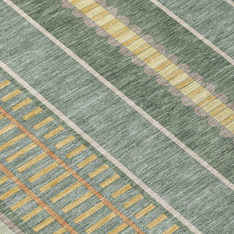 Close-up of green rug with diagonal cream stripe borders and denim blue lines