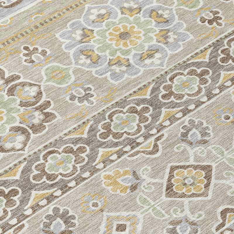 Close-up of beige, ivory, and gray tribal area rug pattern with floral clusters and medallions.