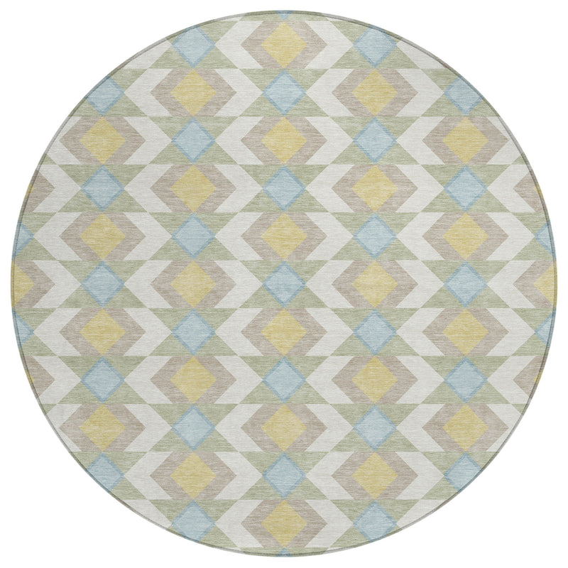 Round area rug showing geometric diamond pattern in ivory with accents of blue, yellow, and green.