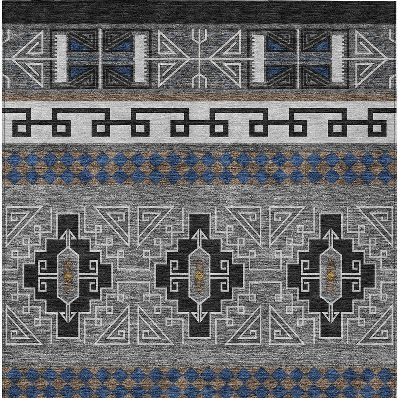 Tribal rug close-up showing arrow medallions, gray ground, and blue diamond stripe