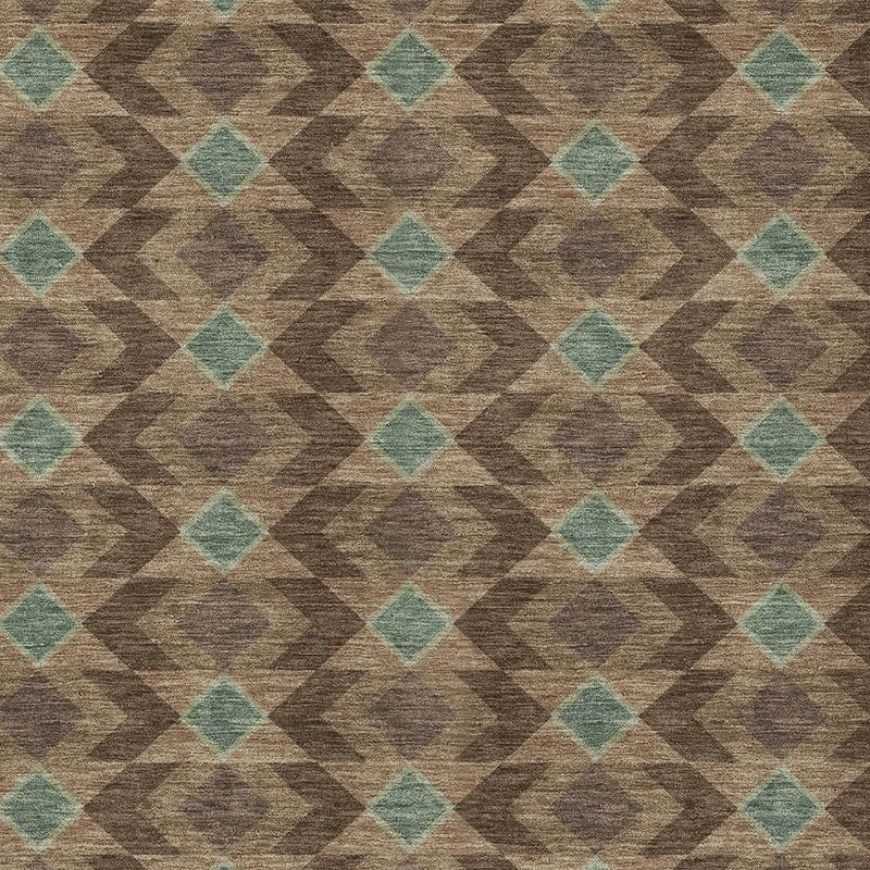 Close-up of brown area rug texture with teal diamond and zigzag pattern