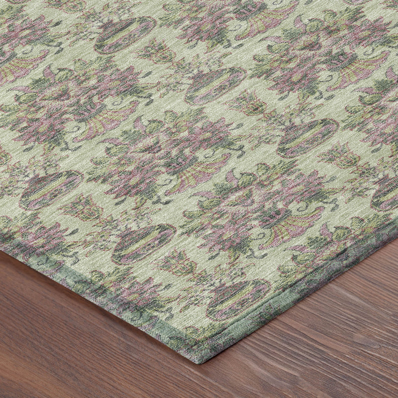 Corner view of green-beige floral urn area rug with muted multicolor pattern