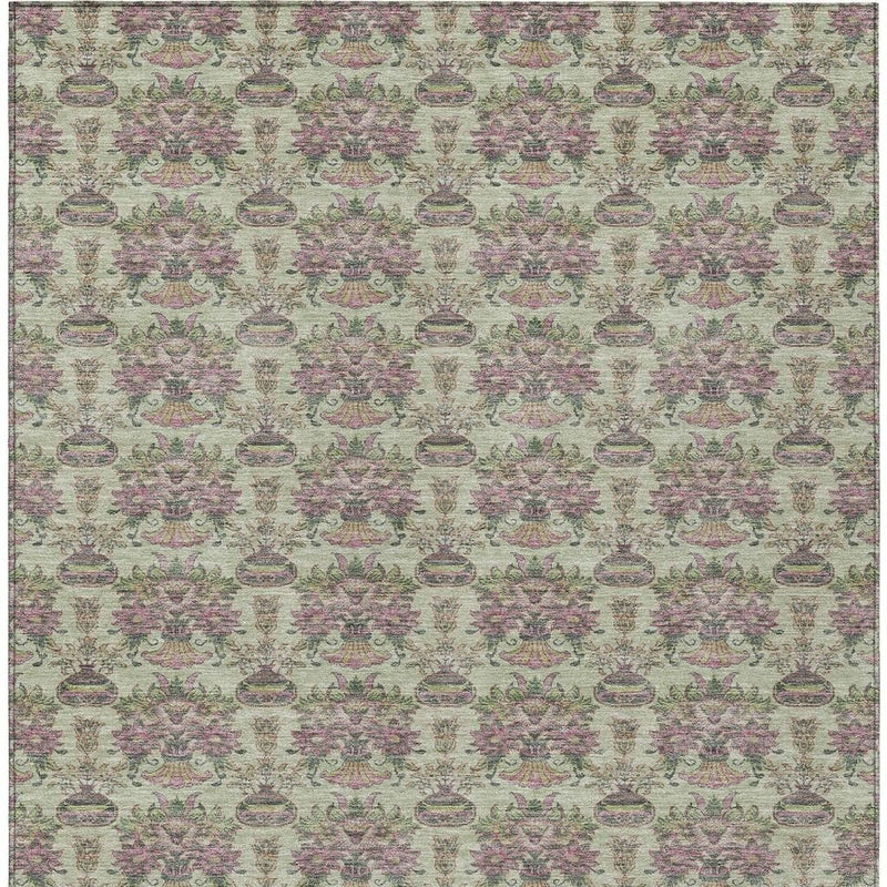 Green-beige area rug with repeating floral urn pattern and simple border