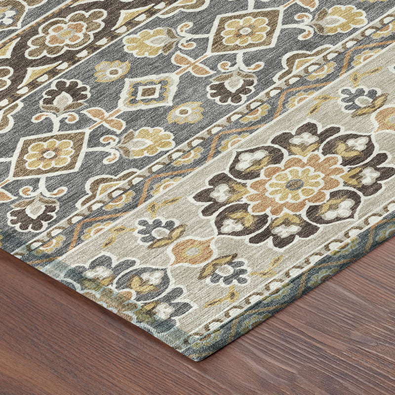 Gray and ivory tribal area rug corner with dense floral and geometric pattern